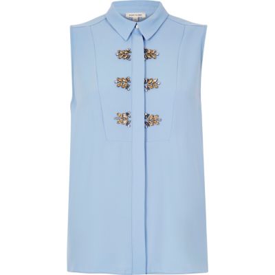 Light blue embellished sleeveless blouse